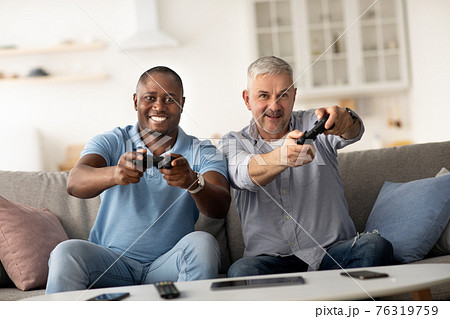 Fun at home together and modern technology at leisure time Fun at home together and modern technology at leisure time 76319759