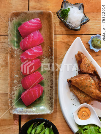 Closeup of fresh sushi on ceramic dish Closeup of fresh sushi on ceramic dish 76322014