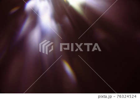 colorful warm rainbow light leaks on black background with dust texture 76324524