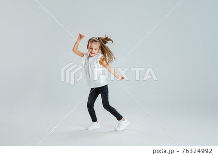 Pretty caucasian girl portrait isolated on white studio background with copyspace Pretty caucasian girl portrait isolated on white studio background with copyspace 76324992