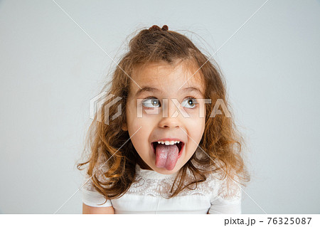 Pretty caucasian girl portrait isolated on white studio background with copyspace Pretty caucasian girl portrait isolated on white studio background with copyspace 76325087