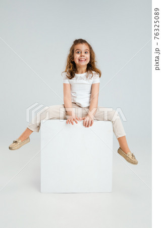 Pretty caucasian girl portrait isolated on white studio background with copyspace Pretty caucasian girl portrait isolated on white studio background with copyspace 76325089