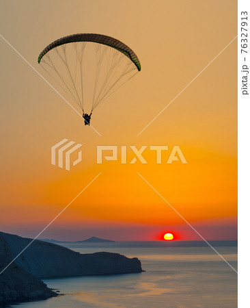 paraglider pilot fly in sky on beauty nature mountain and sea landscape 76327913