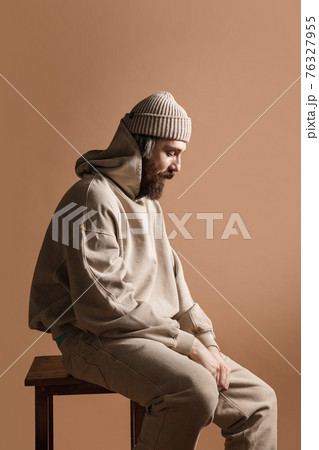 Half-length portrait of Caucasian man isolated over light yellow background. 76327955