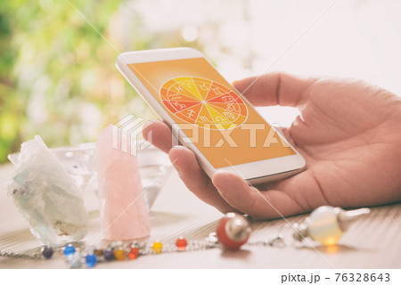 Modern astrology concept with mobile 76328643