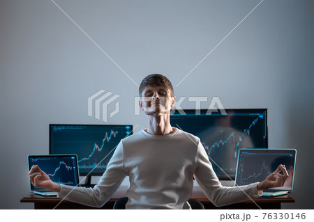 relaxed successful male trader resting with stock exchange graph or chart 76330146