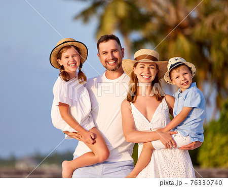 Happy family enjoying summer day in countryside 76330740