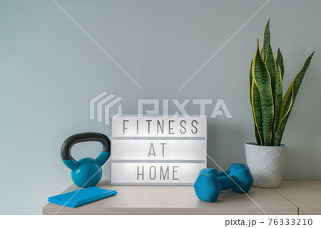 Fitness at home light sign with kettlebell weight and dumbells, resistance bands for pilates online class. Exercise indoors for women. 76333210