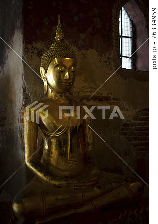 Ancient buddha statue at Wat Suthat temple ,Bangkok ,Thailand 76334959