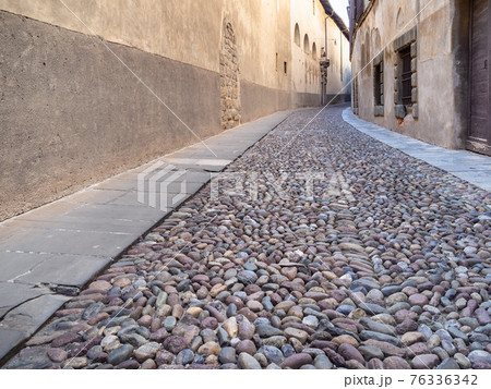 cobblestone pavement at medieval street in Bergamo cobblestone pavement at medieval street in Bergamo 76336342