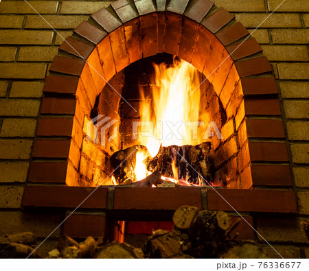 bottom view of brick fireplace with fire bottom view of brick fireplace with fire 76336677