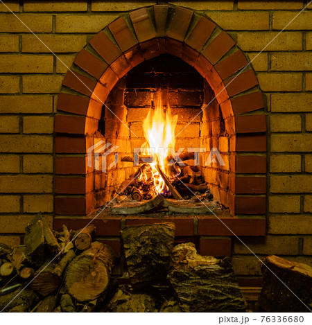 front view of fireplace with burning firewood front view of fireplace with burning firewood 76336680