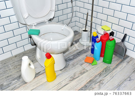 Detergent bottles and sponge for cleaning the toilet in the bathroom in home. Detergents bottles Detergent bottles and sponge for cleaning the toilet in the bathroom in home. Detergents bottles 76337663