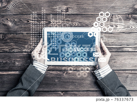Business workplace with tablet device coffee cup and media user interface Business workplace with tablet device coffee cup and media user interface 76337673