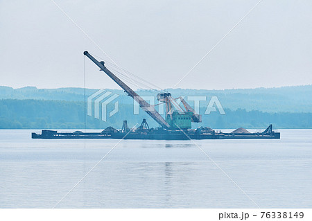 dredging boat is working to deepen the fairway on the river dredging boat is working to deepen the fairway on the river 76338149