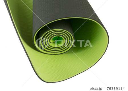 fragment of new green yoga mat, fitness or hiking, close-up, on white background 76339114