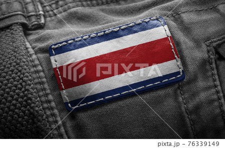 Tag on dark clothing in the form of the flag of the Costa Rica Tag on dark clothing in the form of the flag of the Costa Rica 76339149