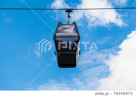 Cable car or funicular on the background of blue sky Cable car or funicular on the background of blue sky 76340973