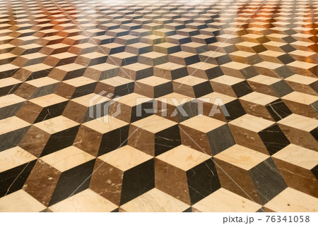 Brown, black, light rhombic texture on the floor. Rhombic slab. Brown, black, light rhombic texture on the floor. Rhombic slab. 76341058