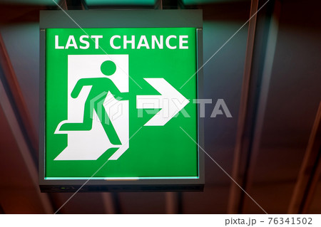 The emergency exit sign indicates the direction of way to last chance. The emergency exit sign indicates the direction of way to last chance. 76341502