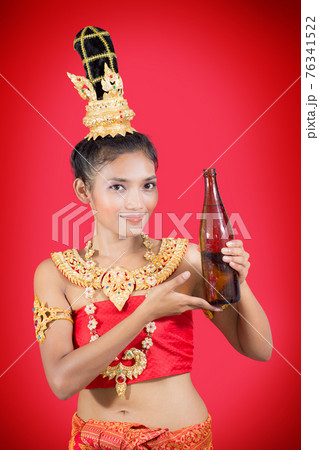 Thai woman holding a bottle of drink 76341522