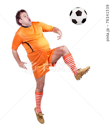 Soccer football player kicking the ball isolated on a white background 76341539