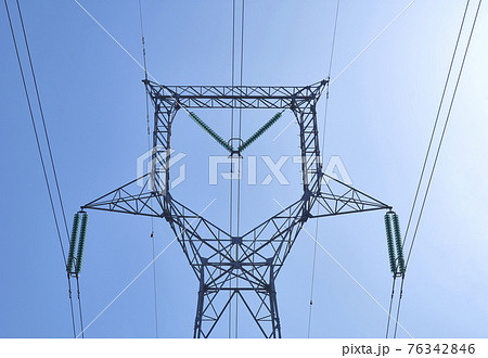 High voltage electrical power distribution turret over clear sky High voltage electrical power distribution turret over clear sky 76342846