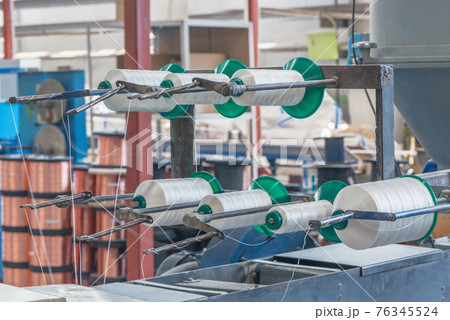 Spools of thread inside of the plant. Spools of thread inside of the plant. 76345524