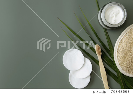 Bath accessories flat lay on green background. Plastic free environment concept Bath accessories flat lay on green background. Plastic free environment concept 76348663