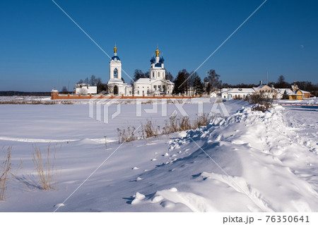 Uspensky Dunilovsky convent in the village of Dunilovo, Ivanovo region, on a sunny winter day. Uspensky Dunilovsky convent in the village of Dunilovo, Ivanovo region, on a sunny winter day. 76350641