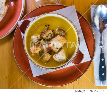 Top view of cream soup with croutons 76352903