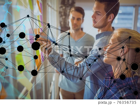 Network of connections against office colleagues writing on memo notes on glass board at office 76356735