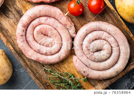 Raw meat sausage, on gray background, top view flat lay Raw meat sausage, on gray background, top view flat lay 76358964