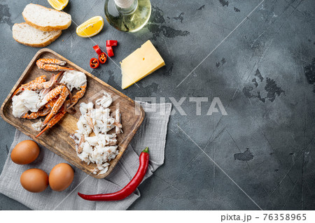 Omelette ingredients with pepper, crab meat, egg, cheese, on gray background, top view flat lay , with copyspace and space for text Omelette ingredients with pepper, crab meat, egg, cheese, on gray background, top view flat lay , with copyspace and space for text 76358965