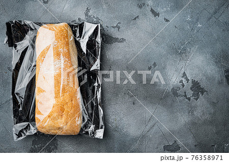 Ciabatta in plastic bag, on gray background, top view flat lay , with copyspace and space for text Ciabatta in plastic bag, on gray background, top view flat lay , with copyspace and space for text 76358971
