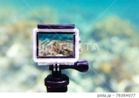 Using action-camera in waterproof box to make photos and video underwater 76364077