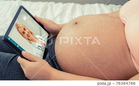 Doctor telemedicine service online video with pregnant woman for prenatal care 76364766