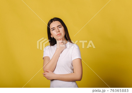 Portrait of pretty woman standing isolated over yellow background. Looking camera. Everything is bad. Disappointed face 76365883