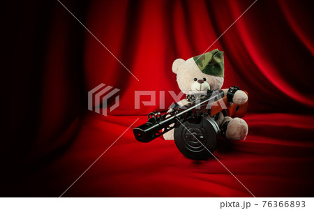 creative teddy bear in a military cap with a PPSH-41 machine gun symbol of the victory of the Red Army in World War II in bdsm belts 76366893