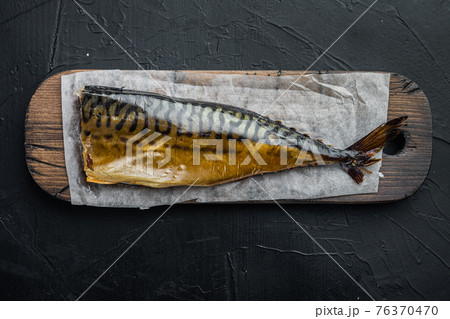 Smoked fish, on black background, top view flat lay 76370470