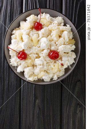 Glorified rice is a dessert salad popular in the Midwestern cuisine served in Minnesota and other states close-up in a plate. Vertical top view 76371842