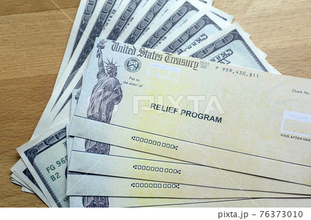 USA dollars background. American rescue plan, USA relief program, stimulus check and Act of 2021 concept. Money, business, profit and livelihood idea 76373010