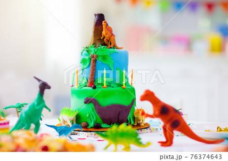 Kids birthday party. Dinosaur theme cake. 76374643