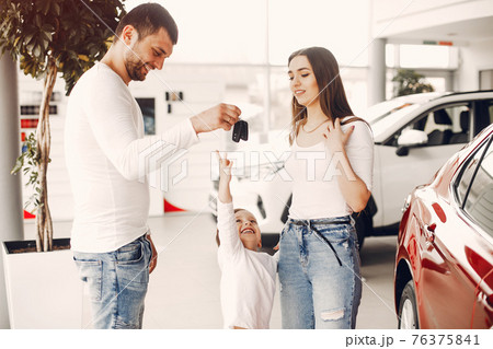 Family with little son in a car salon Family with little son in a car salon 76375841