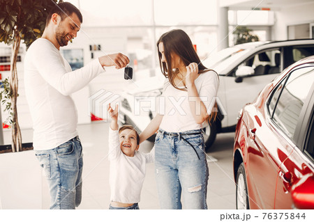 Family with little son in a car salon Family with little son in a car salon 76375844