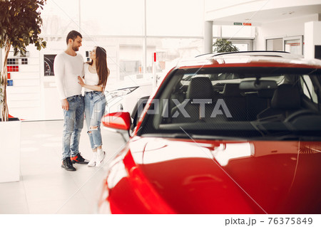 Stylish and elegant family in a car salon 76375849