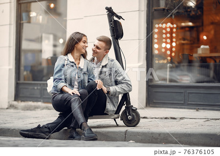 Beautiful couple spend time in a autumn city Beautiful couple spend time in a autumn city 76376105