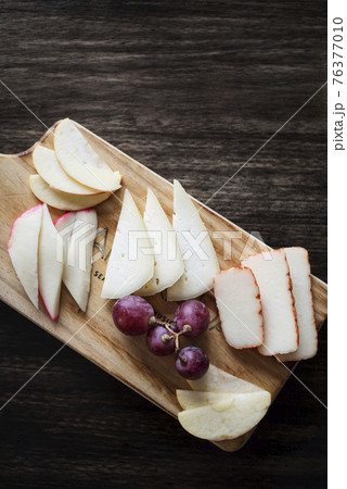 mixed portuguese cheese tapas snack platter with apple and grapes 76377010