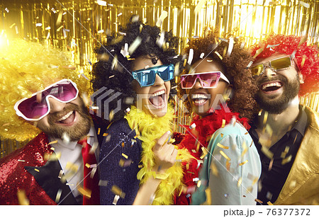 Happy crazy friends in funny wigs, eyeglasses celebrate party headshot portrait 76377372