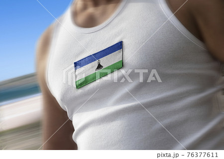 The national flag of Lesotho on the athlete's chest The national flag of Lesotho on the athlete's chest 76377611